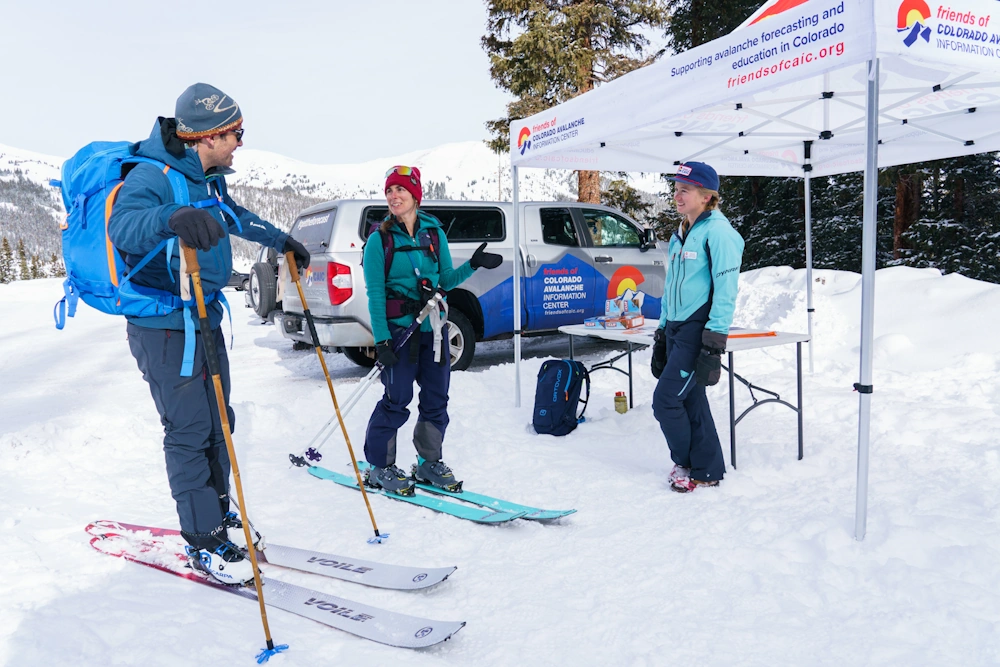 Booth and volunteers for the Avalanche Information Center in Western Colorado
