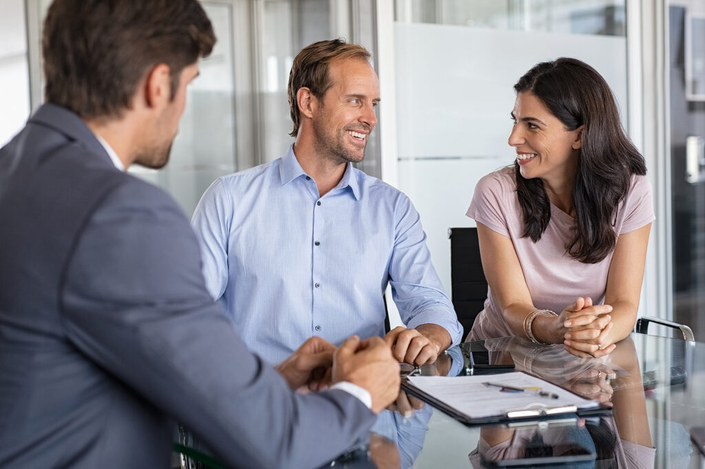 Mature smiling couple meeting financial advisor